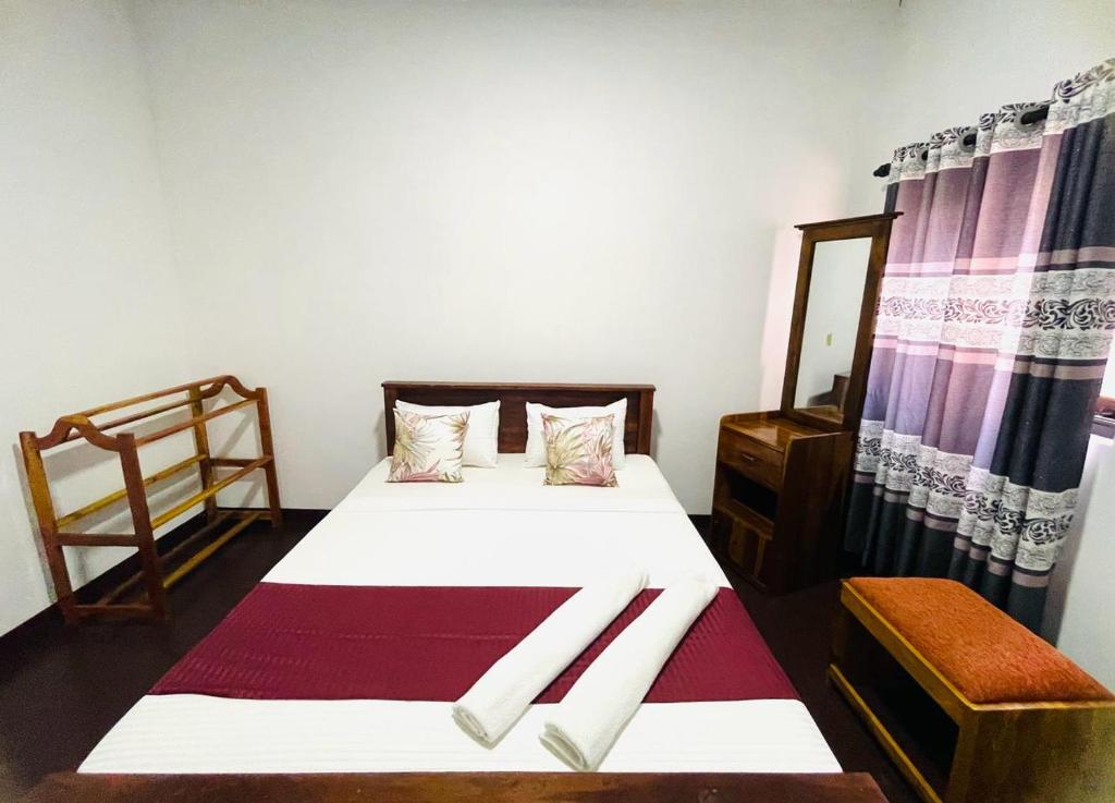Postel nebo postele na pokoji v ubytování Lake Classical Guest House