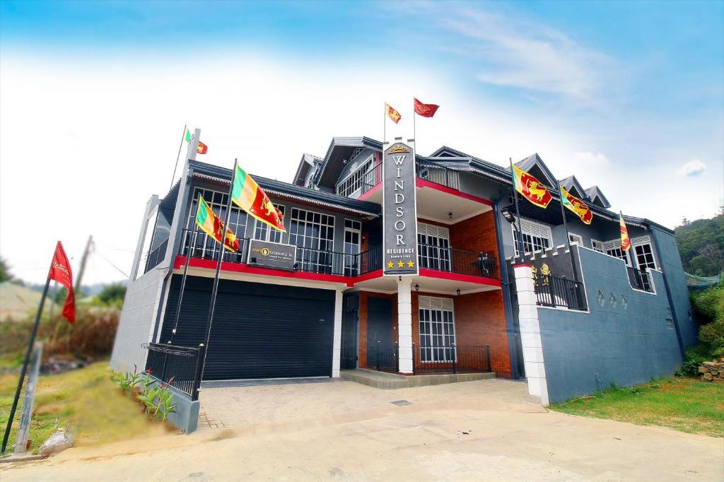 a building with flags in front of it at Windsor Residence in Nuwara Eliya