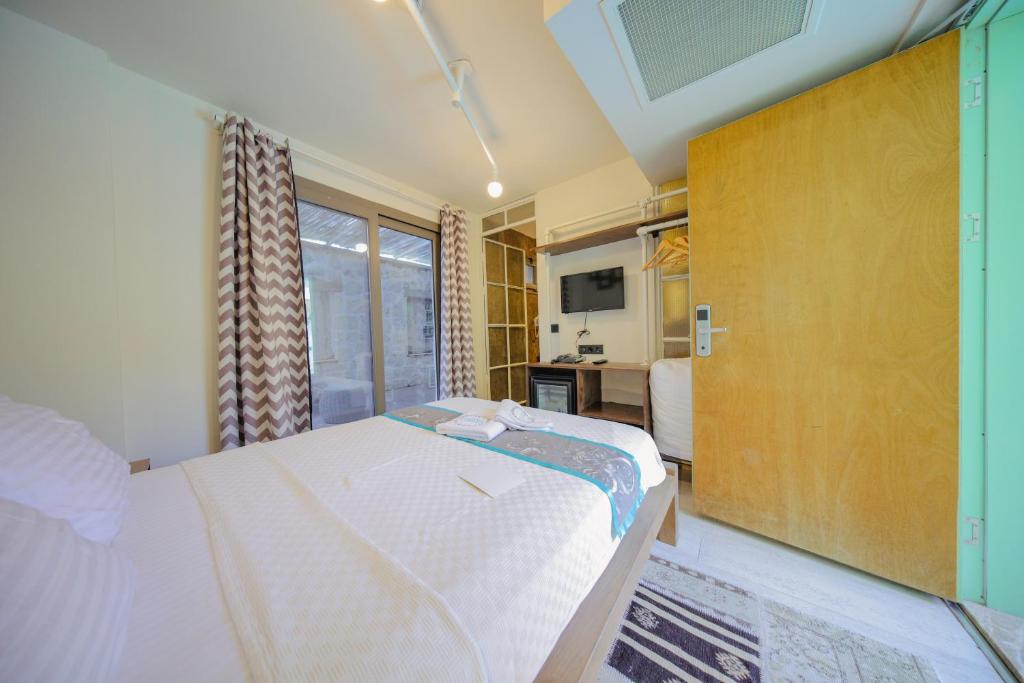 A bed or beds in a room at Brera Alacati - Special Category