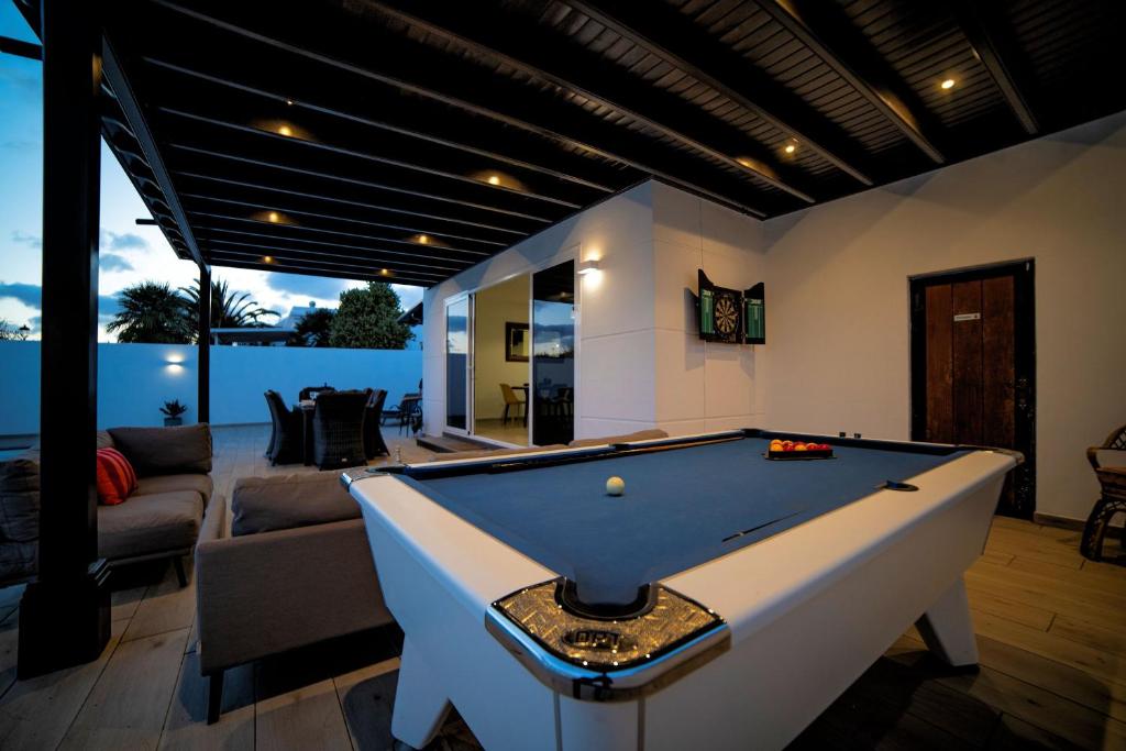 a pool table in the middle of a living room at Beautiful Puerto Del Carmen Villa 3 Bedrooms Villa Crystal Private Pool & Close To Amenities Lanzarote in Tías