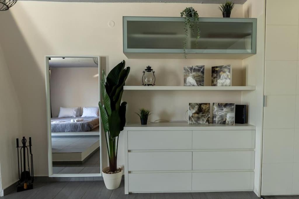 Postel nebo postele na pokoji v ubytování DeKo Penthouse Suite