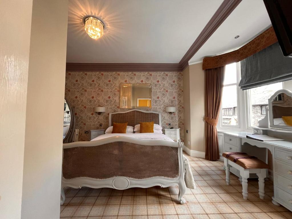 Postel nebo postele na pokoji v ubytování Bowness Bay Suites
