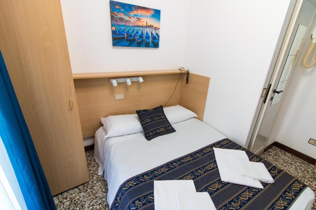 Postel nebo postele na pokoji v ubytování BlueColors Hotel