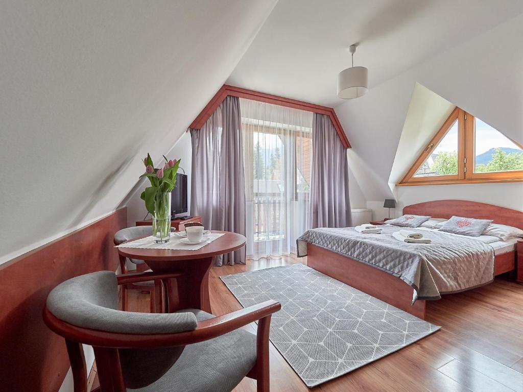 Postel nebo postele na pokoji v ubytování Willa Za Cieszynianką