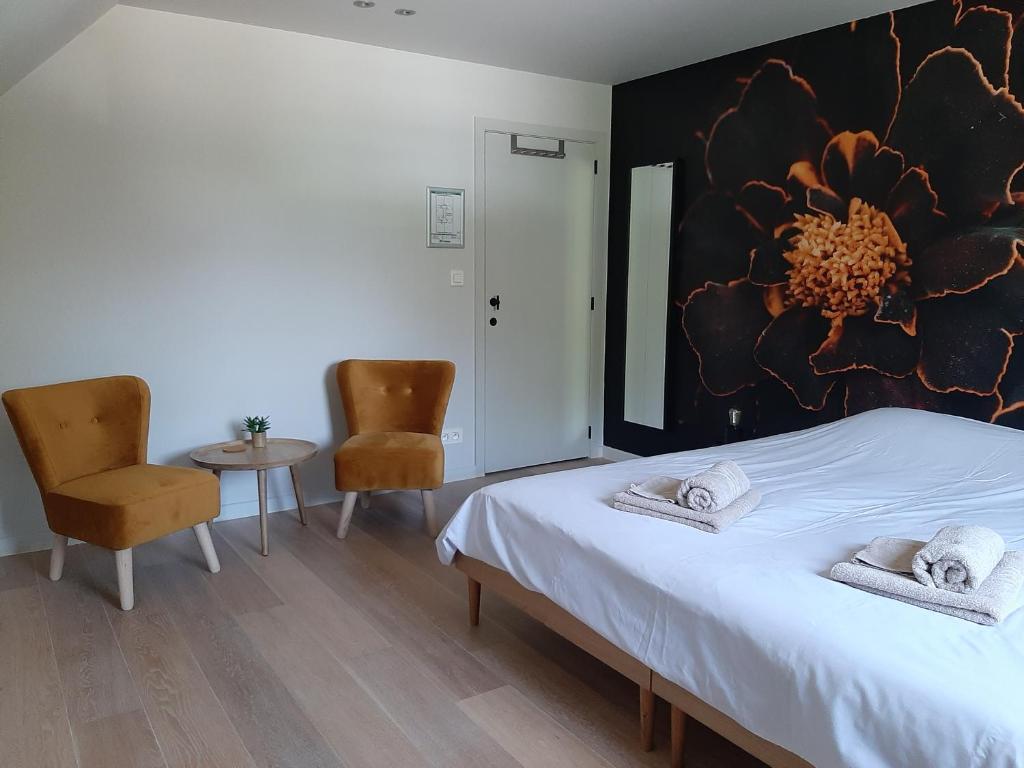 Postel nebo postele na pokoji v ubytování B&B De Levensboom