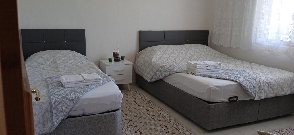 En eller flere senge i et værelse på Demirtepe Konuk Evi