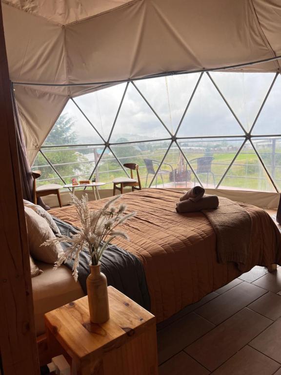 Postel nebo postele na pokoji v ubytování Green Noise Glamping