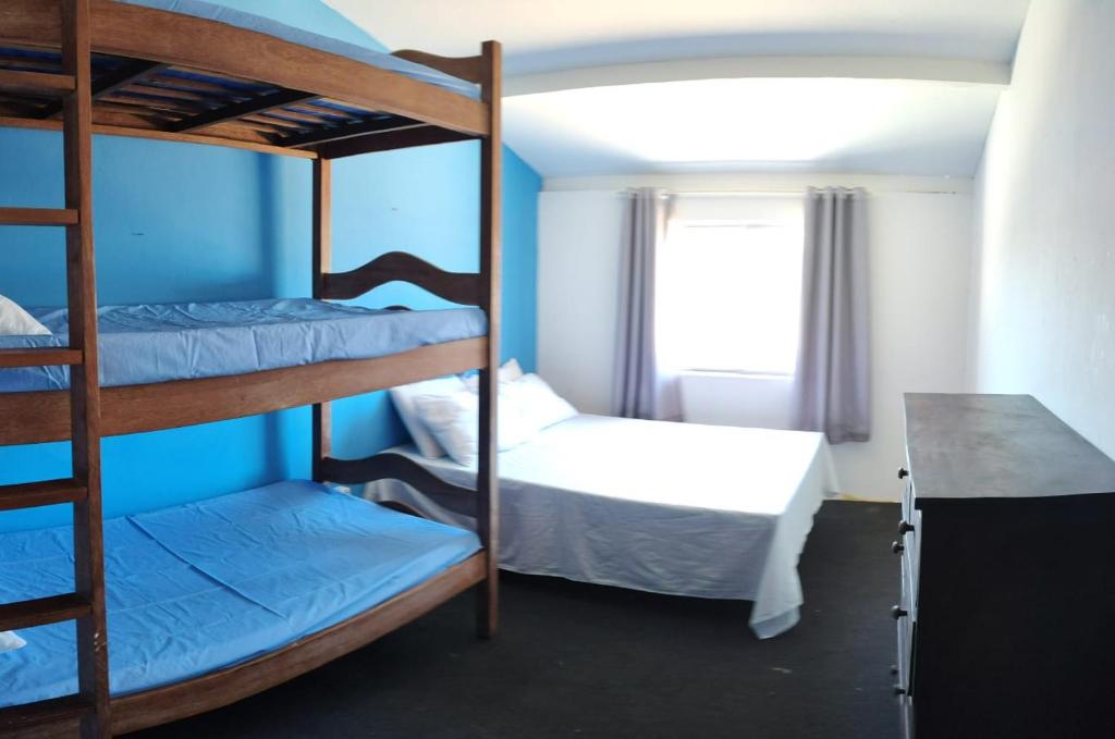 Postel nebo postele na pokoji v ubytování Maré Hostel Itapuã
