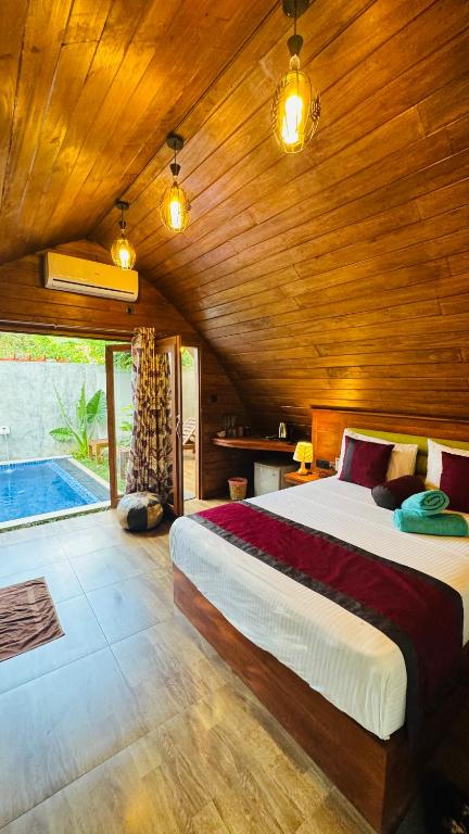 Postel nebo postele na pokoji v ubytování Palmyra Nature Resort Sigiriya