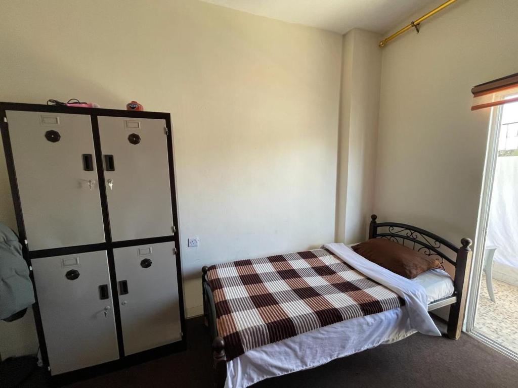 Postel nebo postele na pokoji v ubytování Pizza Street Hostel
