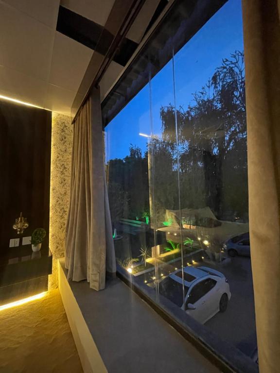 a room with a window with a car in a parking lot at The Life Style Lodges opp Centaurus Mall in Islamabad
