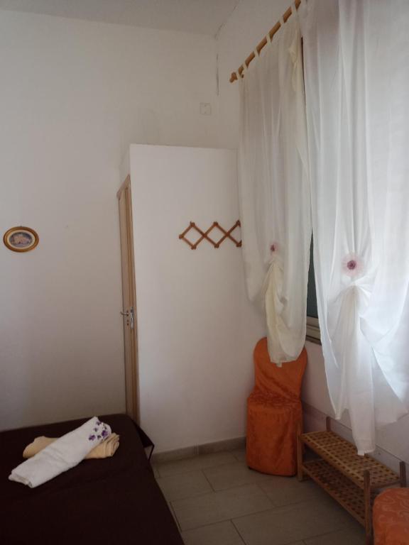 Voodi või voodid majutusasutuse Casa Rosati toas
