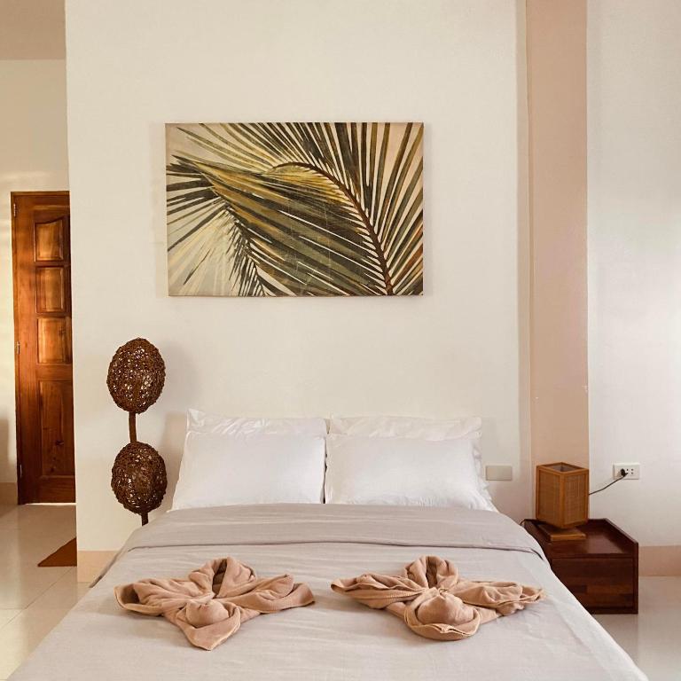 Letto o letti in una camera di Abihon HoferHaus Mactan Guesthouse