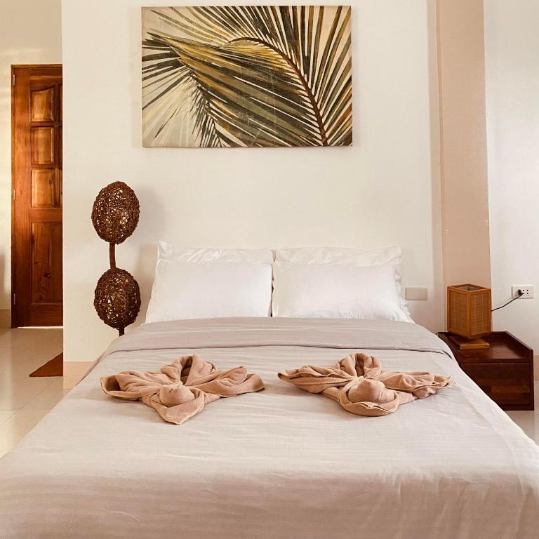 Letto o letti in una camera di Abihon HoferHaus Mactan Guesthouse