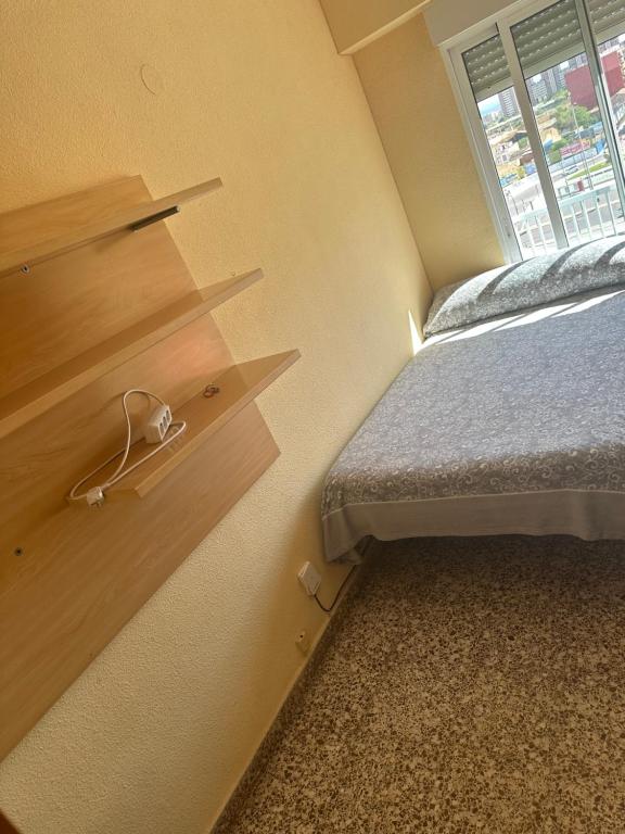 Ένα ή περισσότερα κρεβάτια σε δωμάτιο στο Alojamiento K&K Habitacion encasa particular