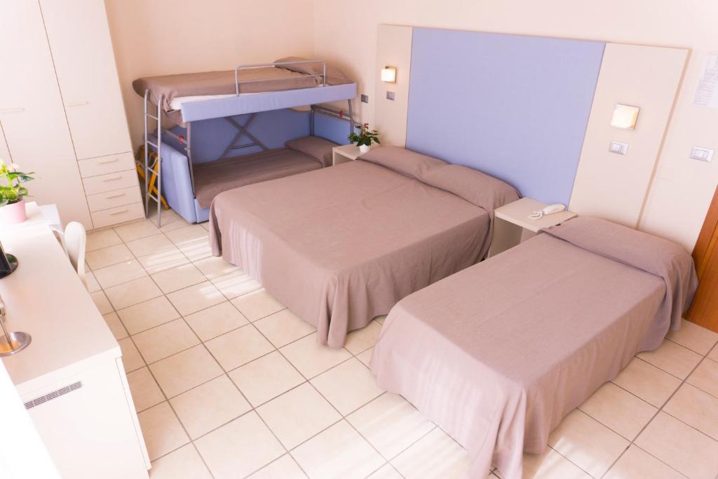 Postel nebo postele na pokoji v ubytování New Hotel Chiari
