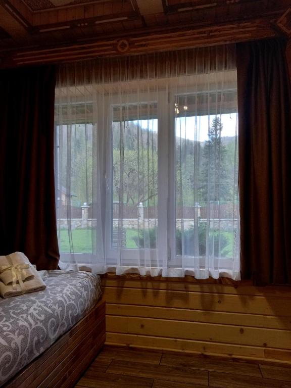 Postel nebo postele na pokoji v ubytování Voyage Tatariv