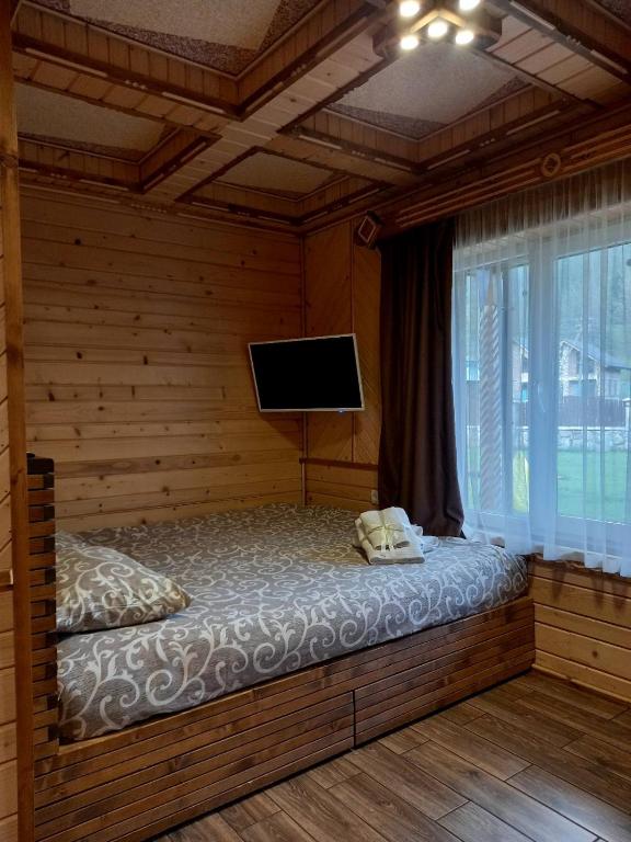 Postel nebo postele na pokoji v ubytování Voyage Tatariv