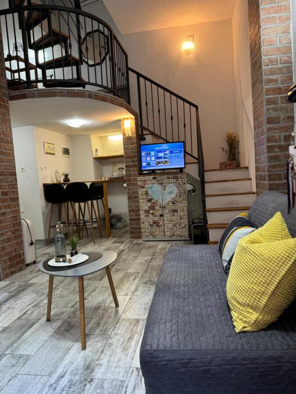 a living room with a couch and a table at Apartment Tena in Senj