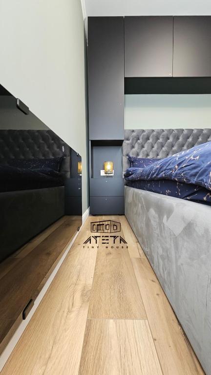 Postel nebo postele na pokoji v ubytování ATETA Tiny House