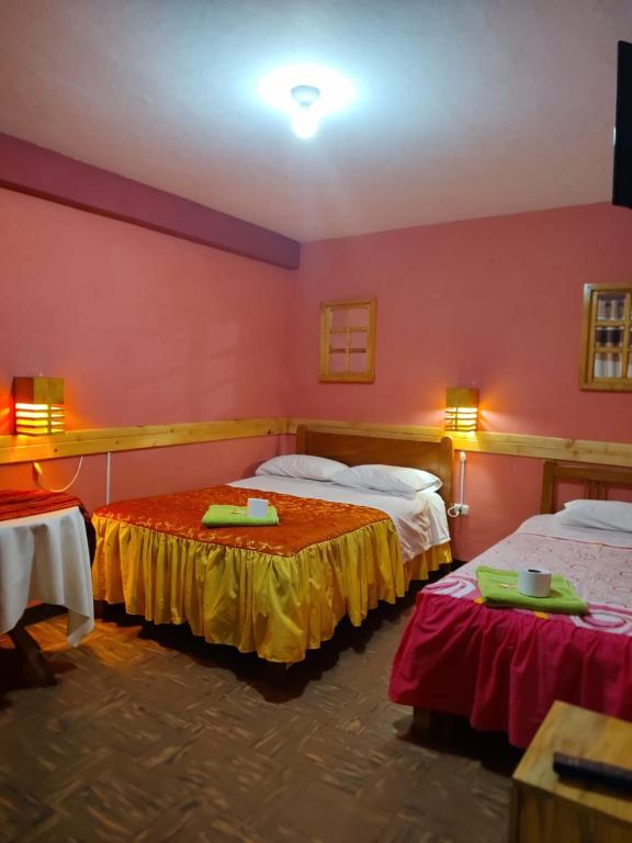 Postel nebo postele na pokoji v ubytování Jaimes Inn Hostel
