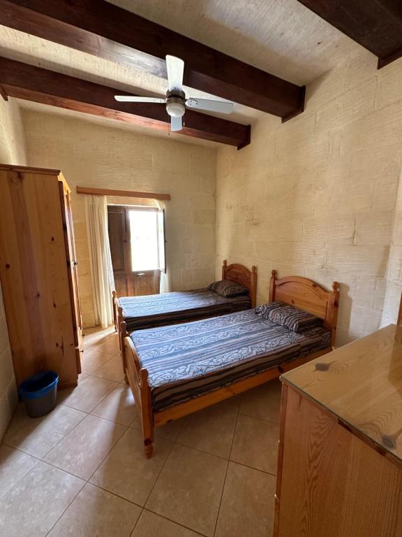 Postel nebo postele na pokoji v ubytování Nawrat Farmhouse