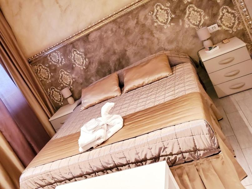 Posteľ alebo postele v izbe v ubytovaní ILLUVIA affitto camere