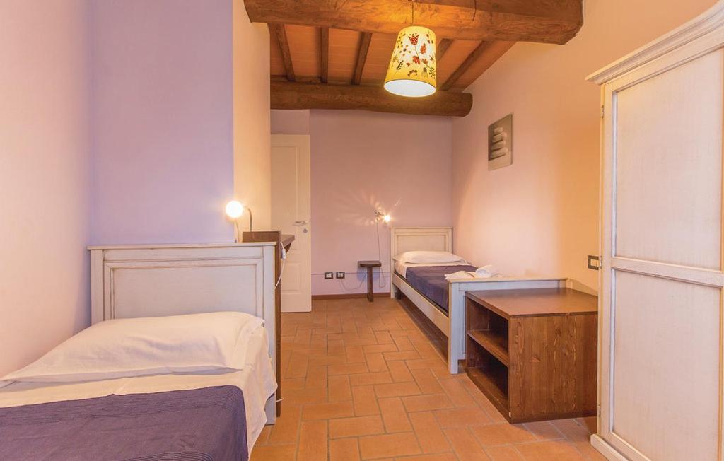 Postel nebo postele na pokoji v ubytování Casa Macinarino APPARTAMENTO 13 con piscina