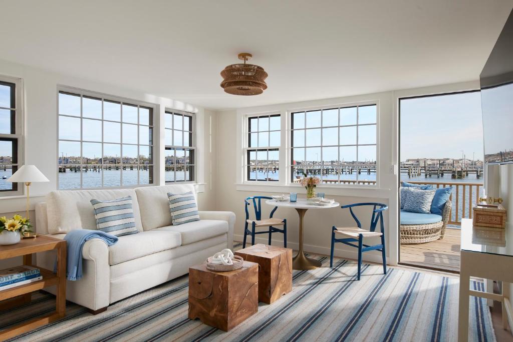 a living room with a couch and a table at The Cottages & Lofts in Nantucket