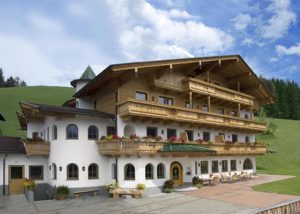 a large building with balconies on the side of it at Alpenkönig in Zell am Ziller