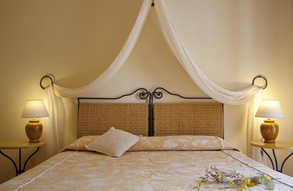 Postel nebo postele na pokoji v ubytování Hotel Gallo Nero
