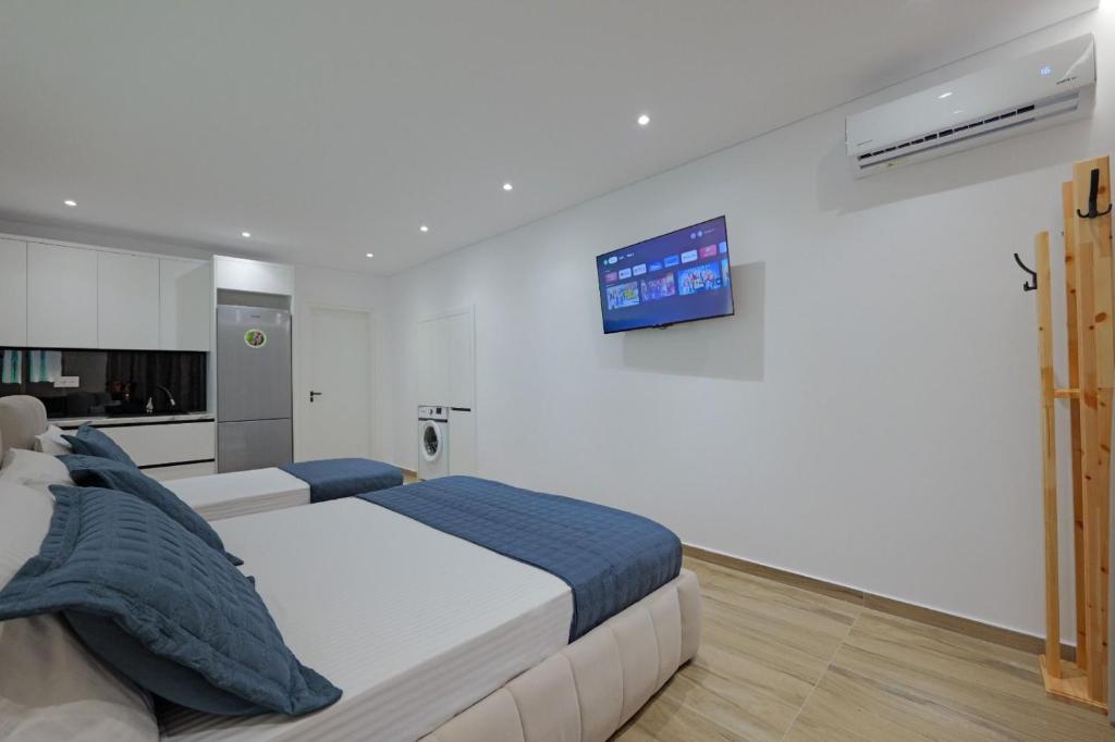 Postel nebo postele na pokoji v ubytování Cako Rooms Saranda