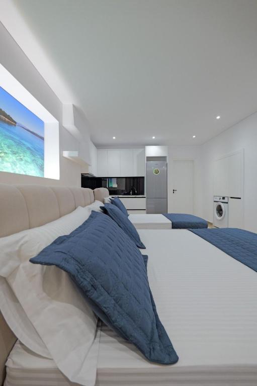 Postel nebo postele na pokoji v ubytování Cako Rooms Saranda