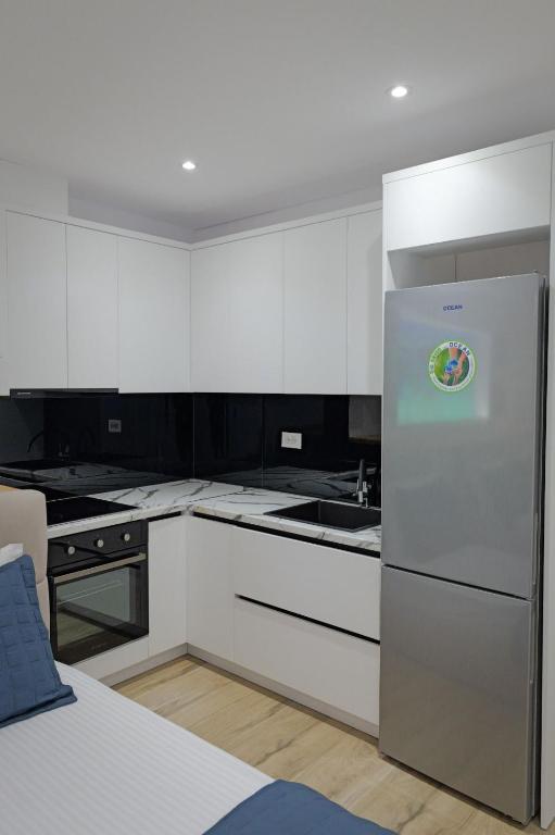 Kuchyň nebo kuchyňský kout v ubytování Cako Rooms Saranda