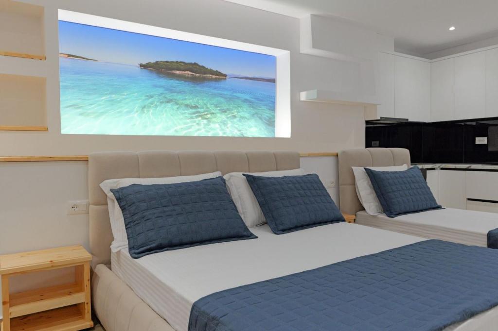 Postel nebo postele na pokoji v ubytování Cako Rooms Saranda