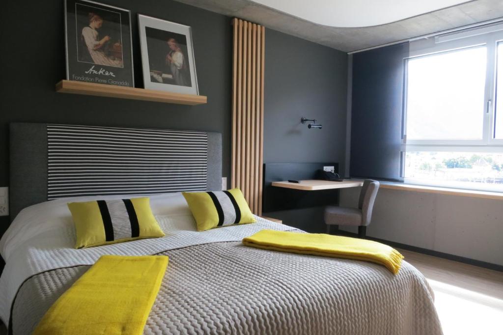 Postel nebo postele na pokoji v ubytování Martigny Boutique-Hôtel