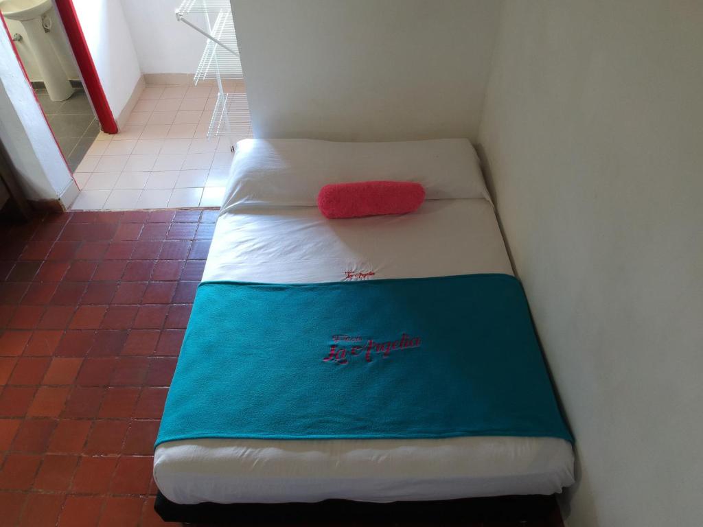 Ένα ή περισσότερα κρεβάτια σε δωμάτιο στο Finca Hotel Pueblito Quindiano