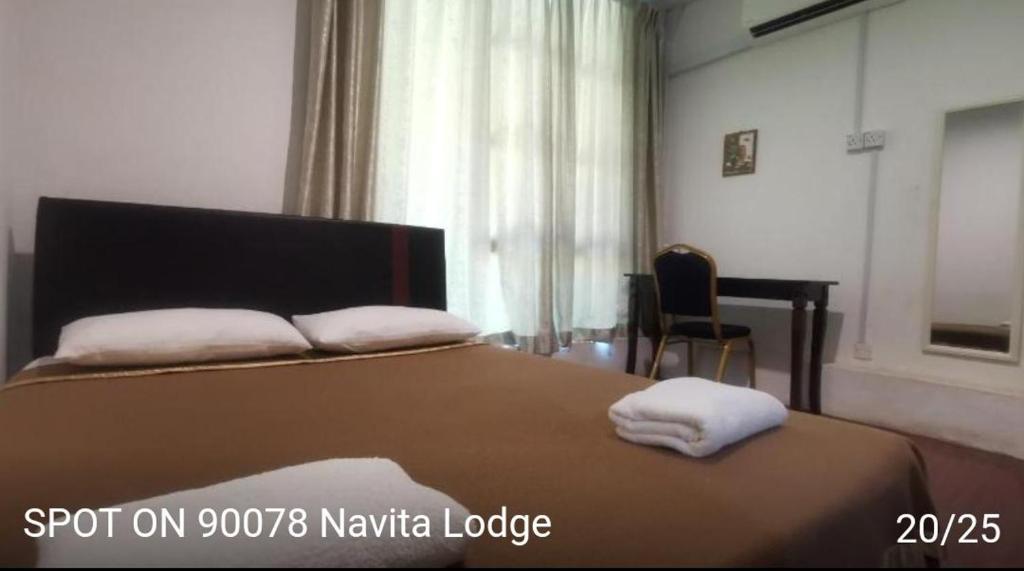 Postel nebo postele na pokoji v ubytování NaVita Lodge