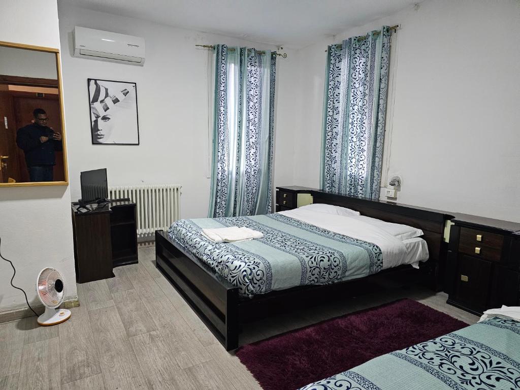 Postel nebo postele na pokoji v ubytování Hotel Giovannina