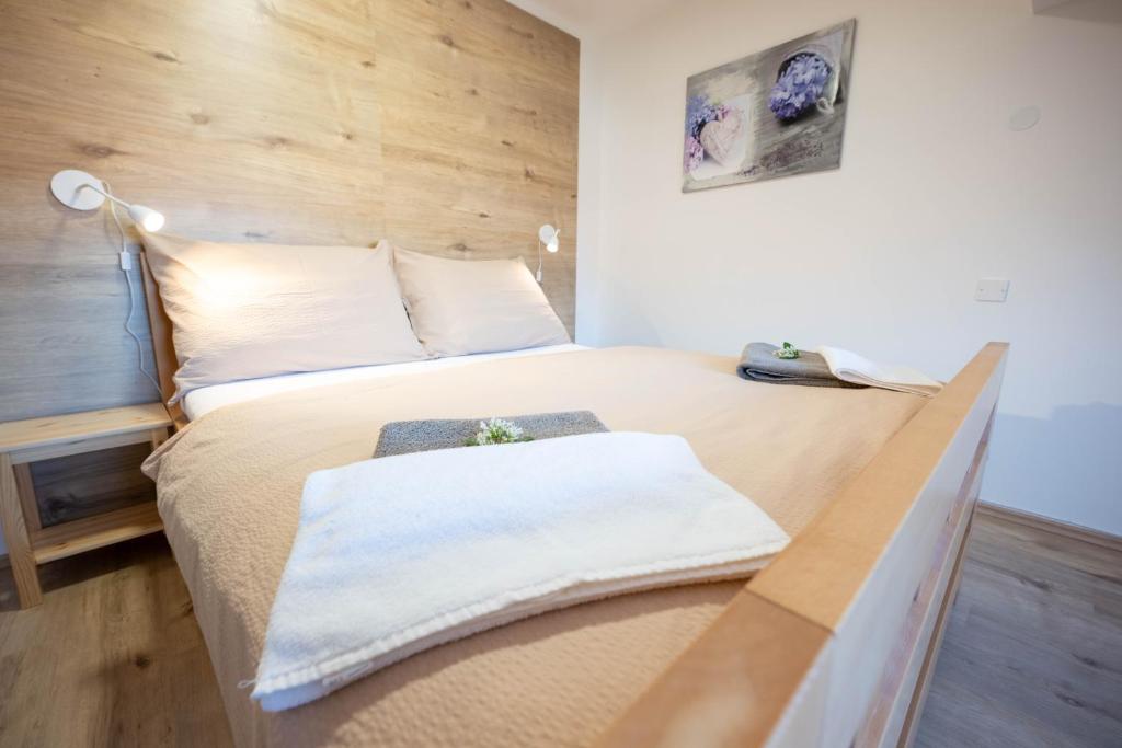 Postel nebo postele na pokoji v ubytování PAPI Apartmán