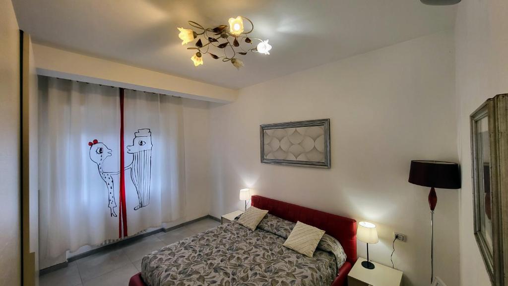 Letto o letti in una camera di Bilocale Manuela in via Signorelli a Garbagnate Milanese