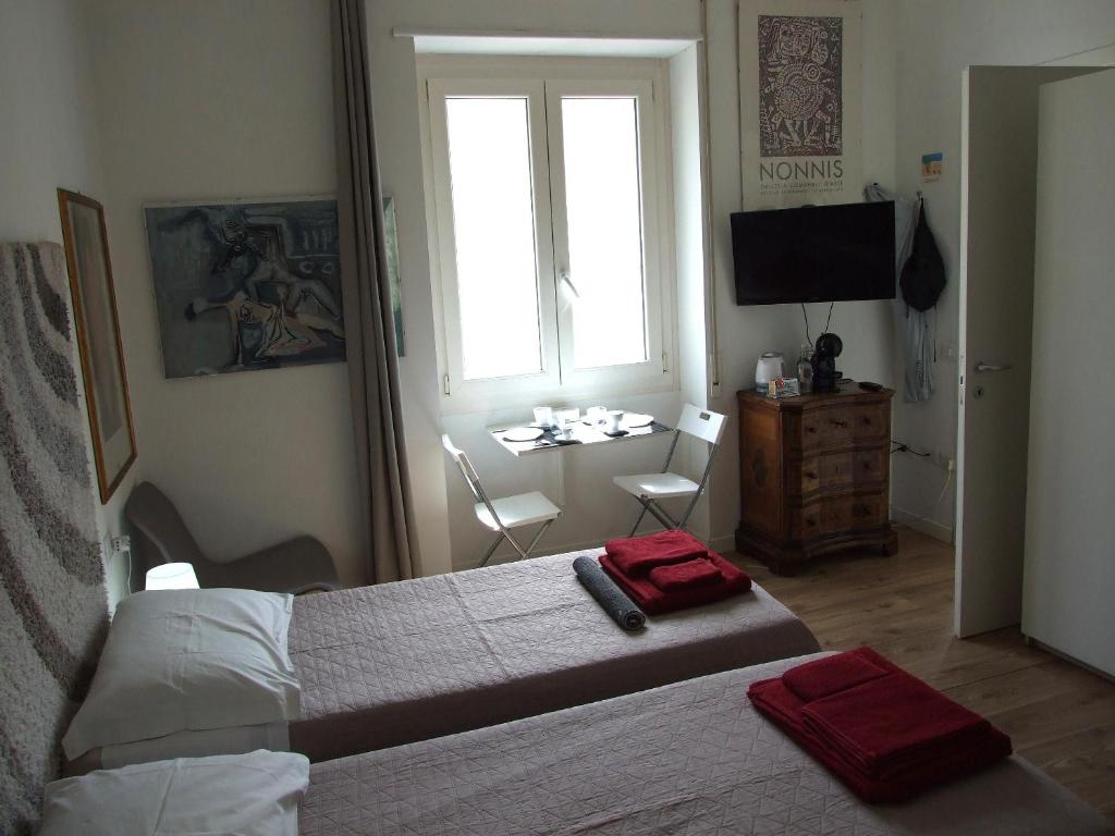 Łóżko lub łóżka w pokoju w obiekcie B&B Leo