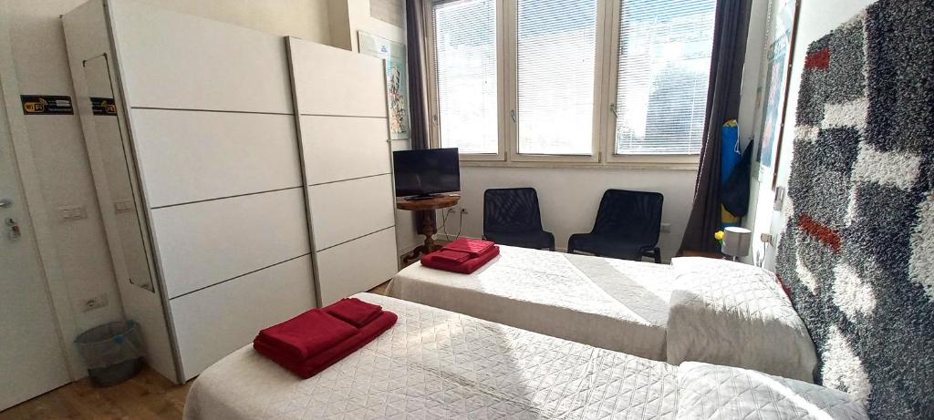 Łóżko lub łóżka w pokoju w obiekcie B&B Leo