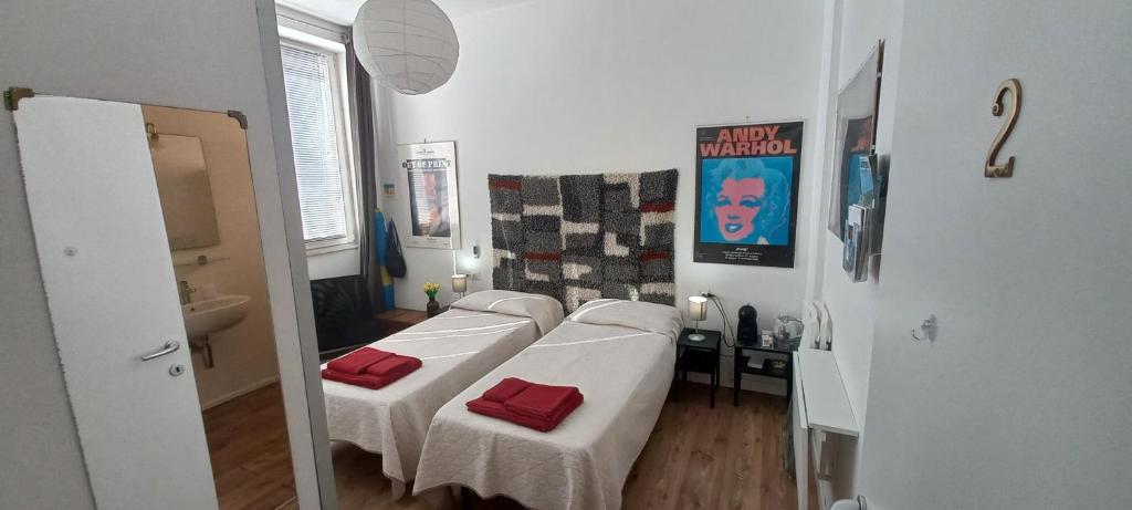 Łóżko lub łóżka w pokoju w obiekcie B&B Leo