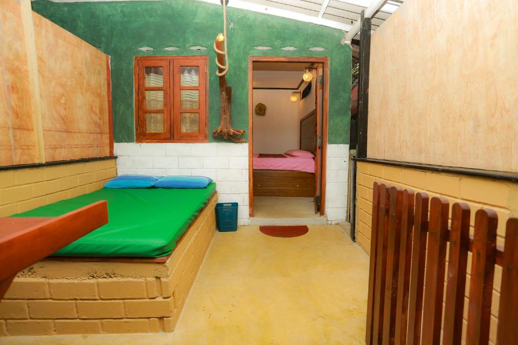 Postel nebo postele na pokoji v ubytování Rosa Shashi Cabanas