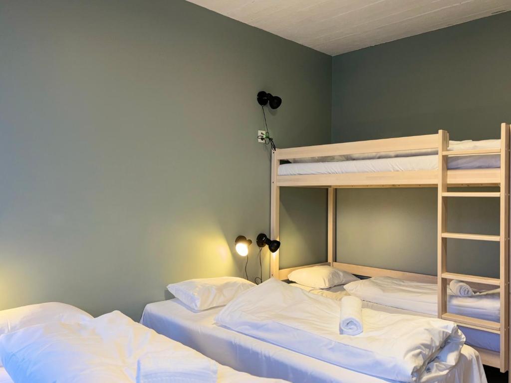 Postel nebo postele na pokoji v ubytování Winjum Hostel Stegastein