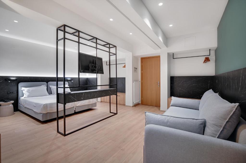 Postel nebo postele na pokoji v ubytování Palladion Hotel
