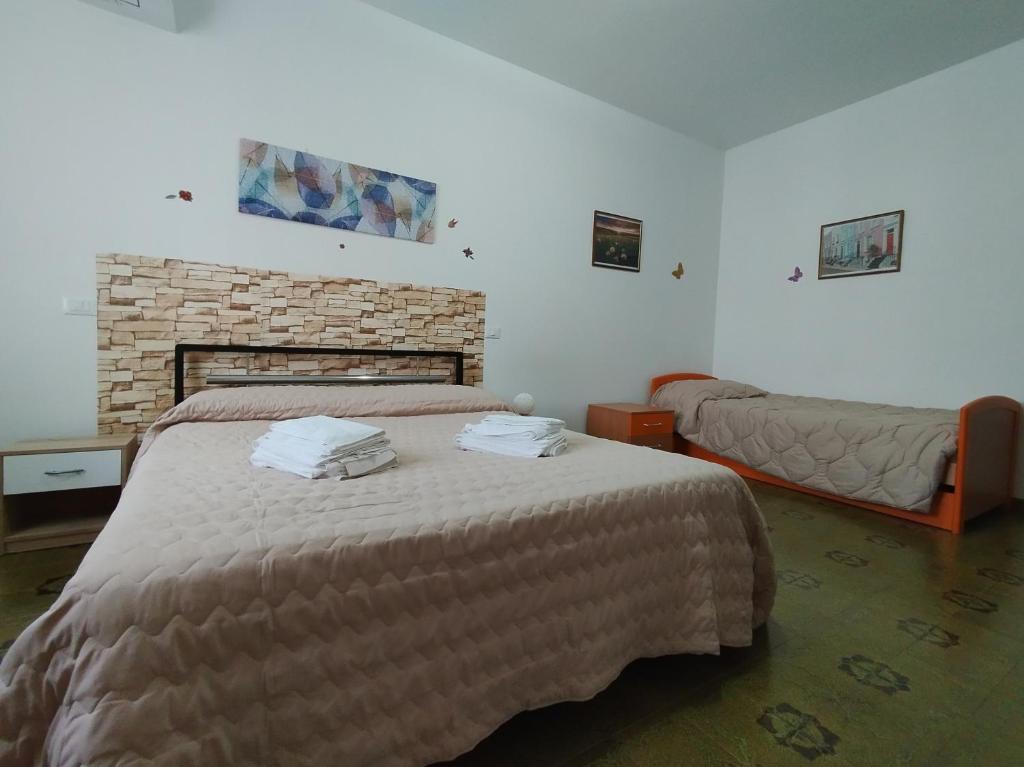 A bed or beds in a room at La Casetta Di Cotignola
