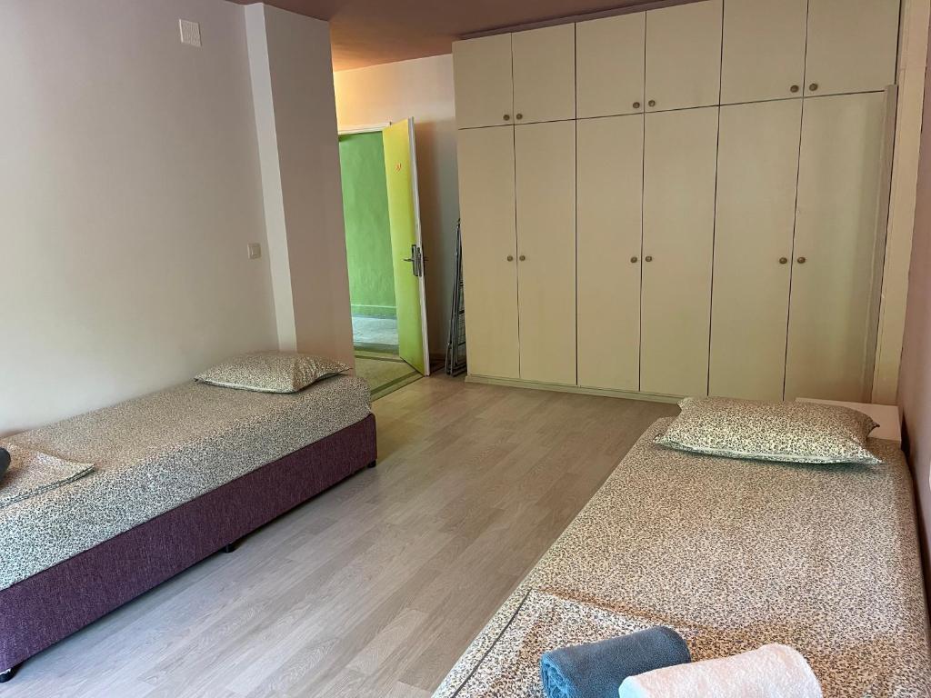 Postel nebo postele na pokoji v ubytování AMADINA Garden