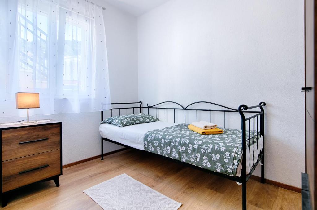 Postel nebo postele na pokoji v ubytování Kut